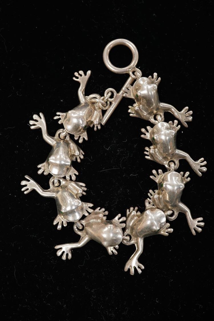 A recent white metal frog necklace, overall length 42cm and matching bracelet, 19cm, both stamped 925, gross 153 grams.